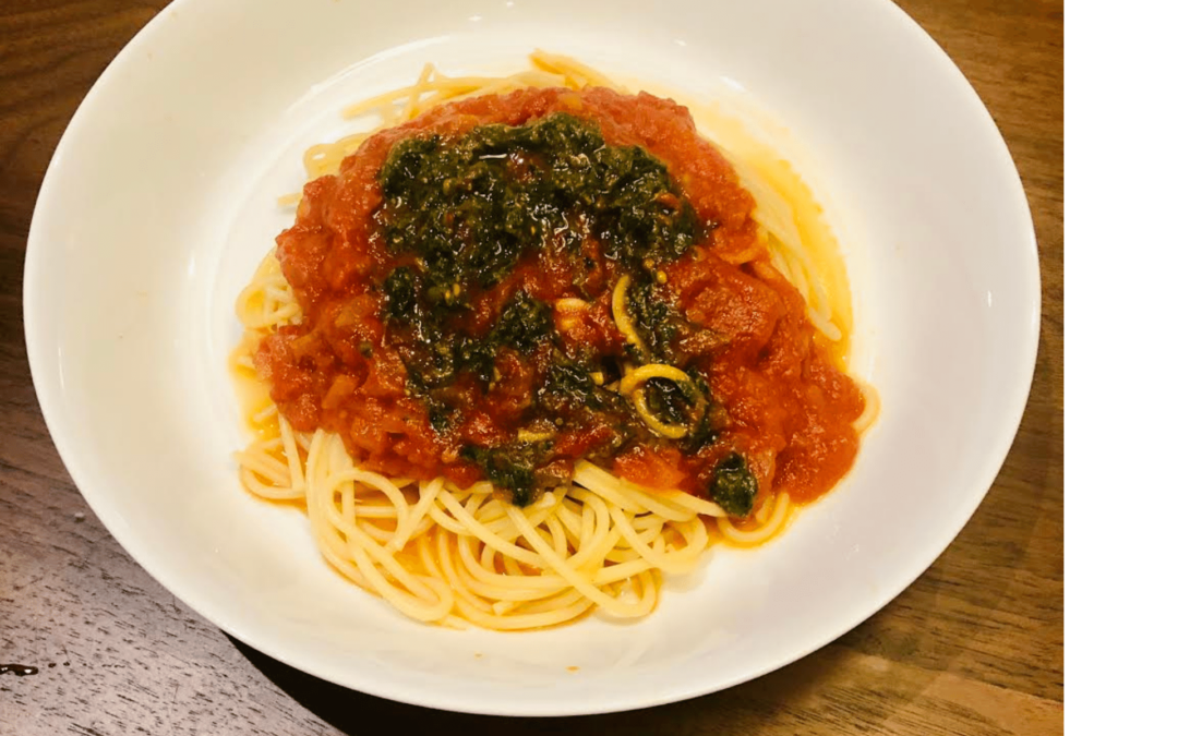 Pasta with Tomato Sauce Topped with Pesto