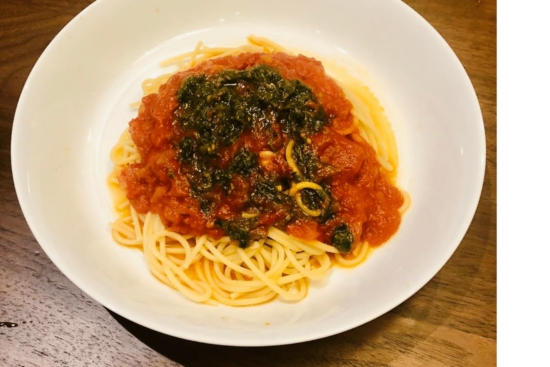 Pasta with Tomato Sauce Topped with Pesto