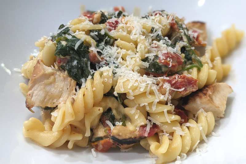 Creamy Parmesan Fusilli with Grilled Chicken, Sun-dried Tomatoes, and Spinach